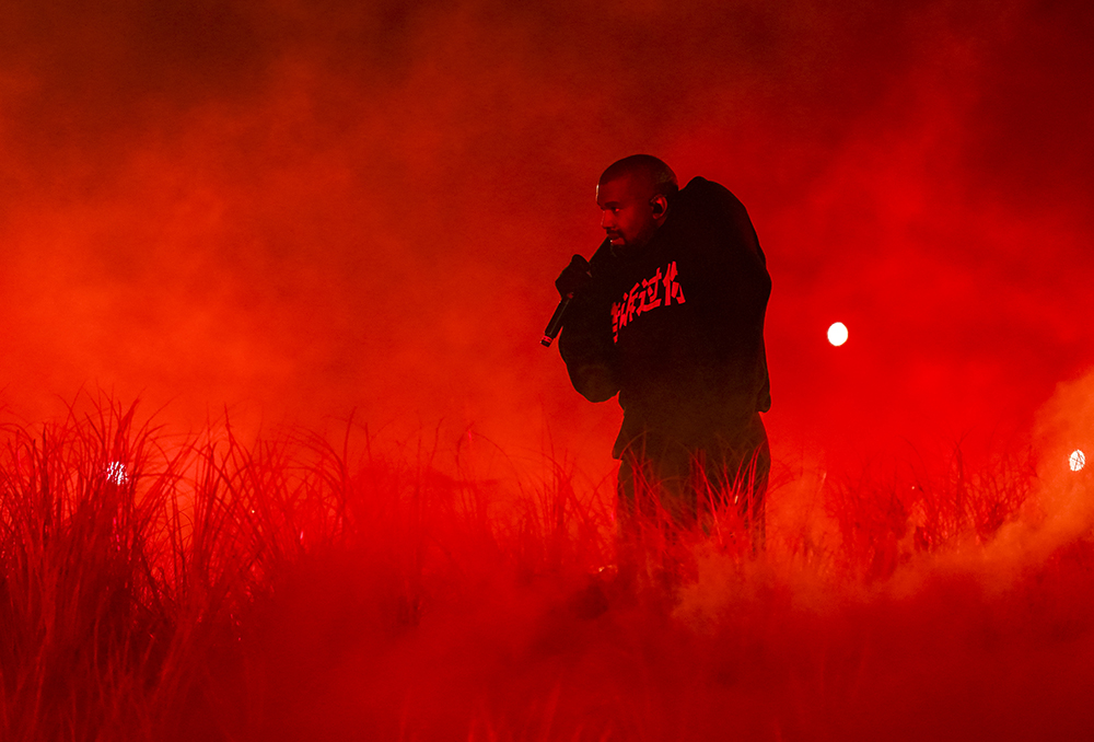 Kanye West is performing on his concert.