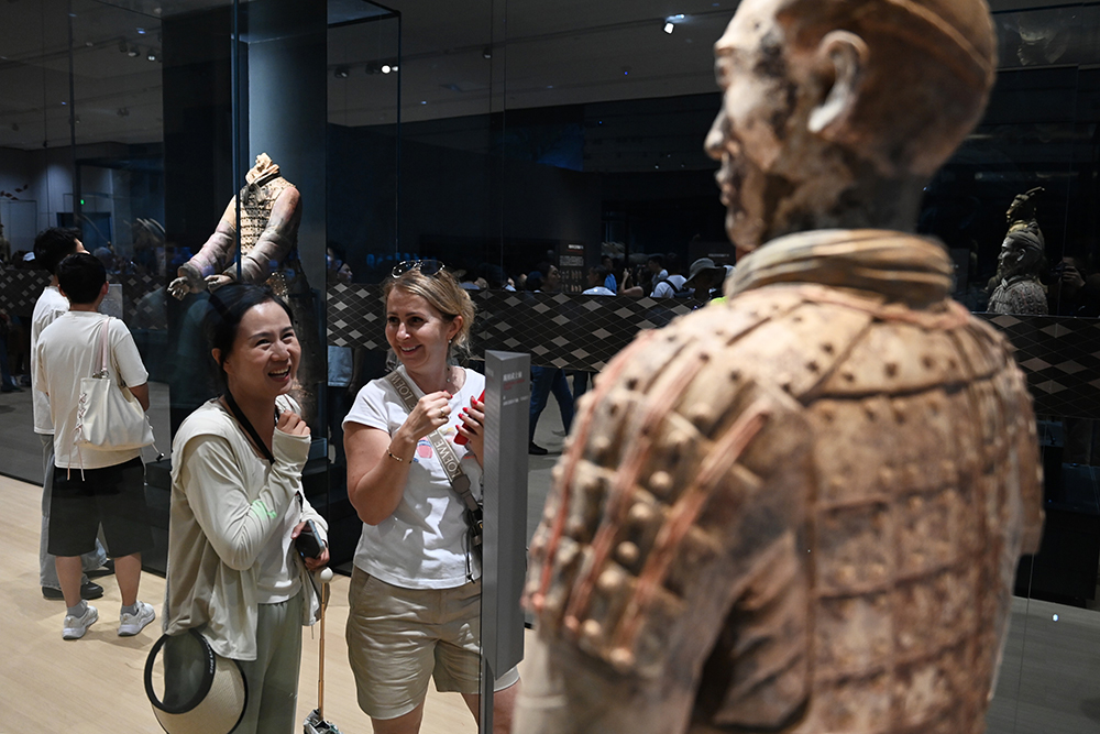 People visit an exhibition, commemorating the 50th anniversary of the discovery and excavation of the iconic Terracotta Warriors, at the Emperor Qinshihuang's Mausoleum Site Museum in Xi'an.