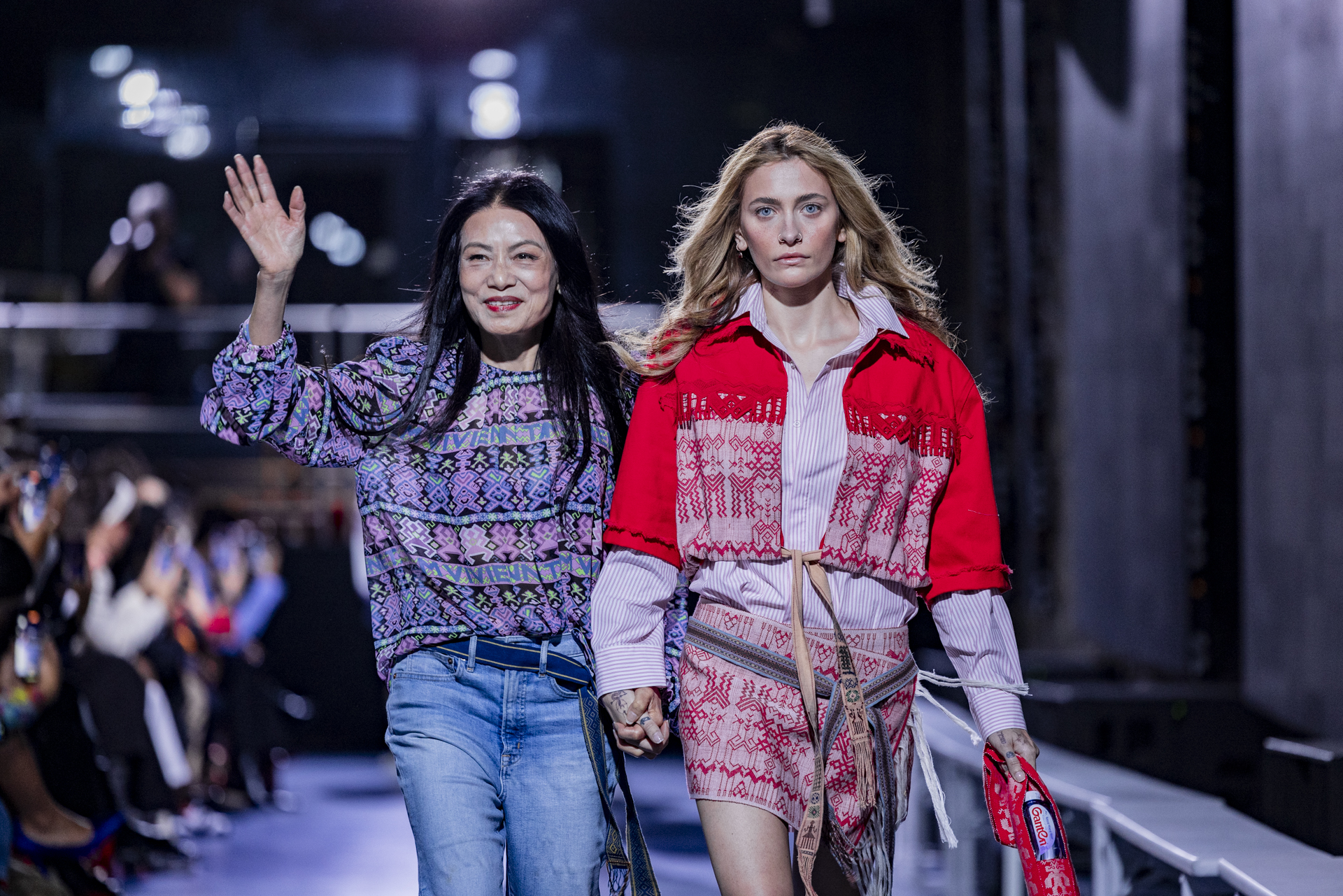 Vivienne Tam and Paris Jackson walking the catwalk.