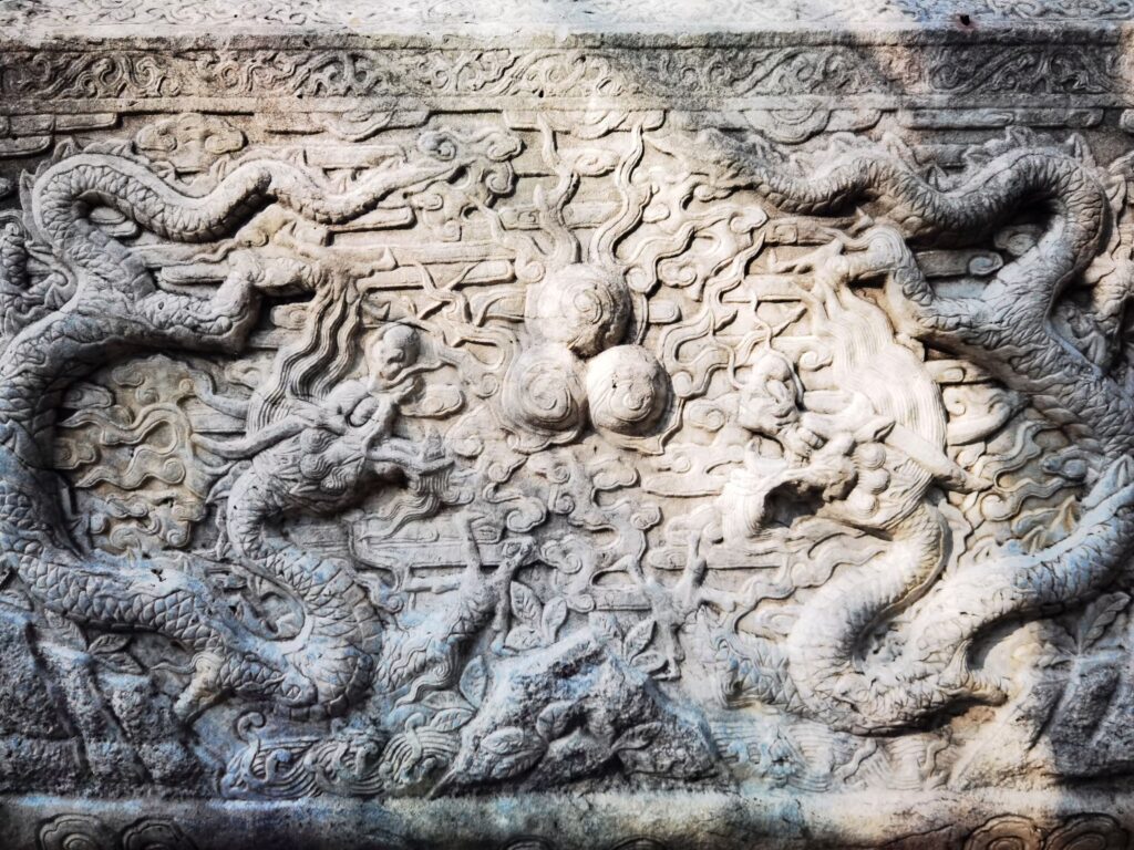  two dragons playing with pearls