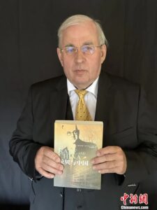 Why do we carry on the spirit of John Rabe?