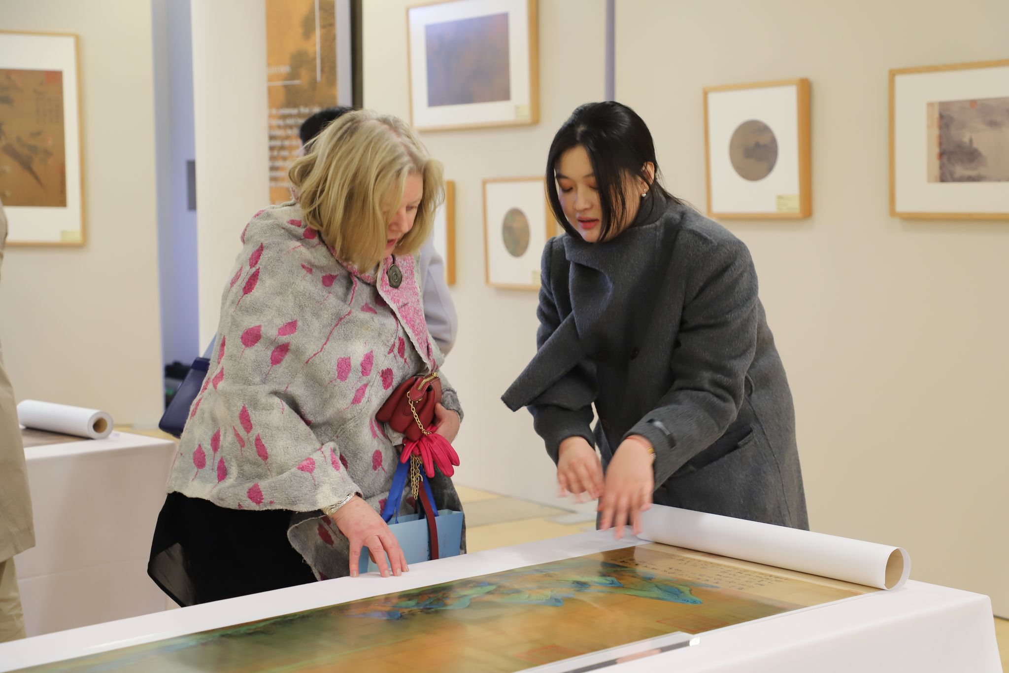 Visitors explore the song dynasty paintings.