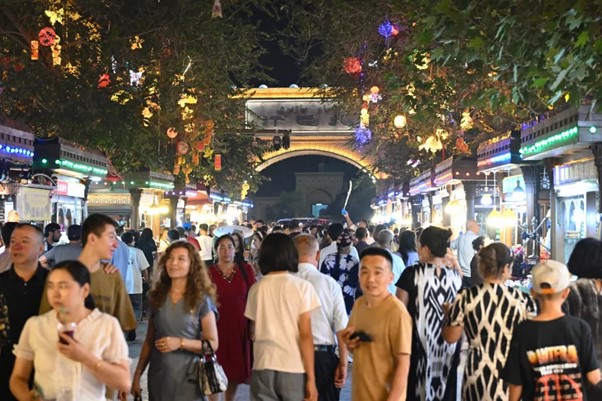On 25 August 2024, tourists visit the scenic spot of the ancient city of Kashgar. Credit, Tian Yuhao.