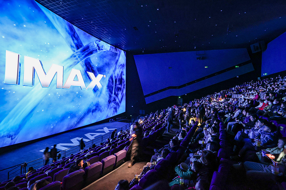 people are watching films.