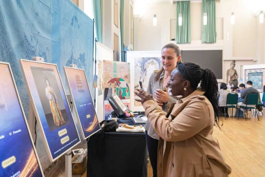 Visitors view the exhibitions at Dunhuang Cultural Week. Image from organisers.