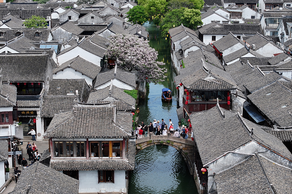 Visitors explore Zhouzhuang