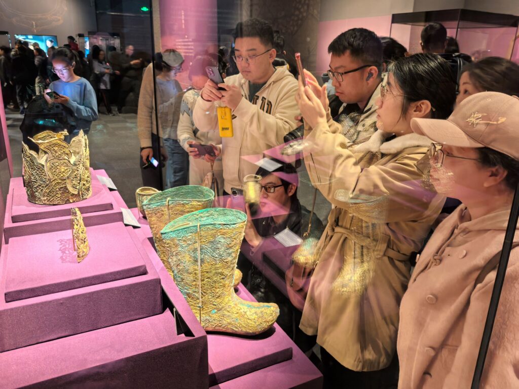 Boots with makaras chasing pearls in a lotus ground