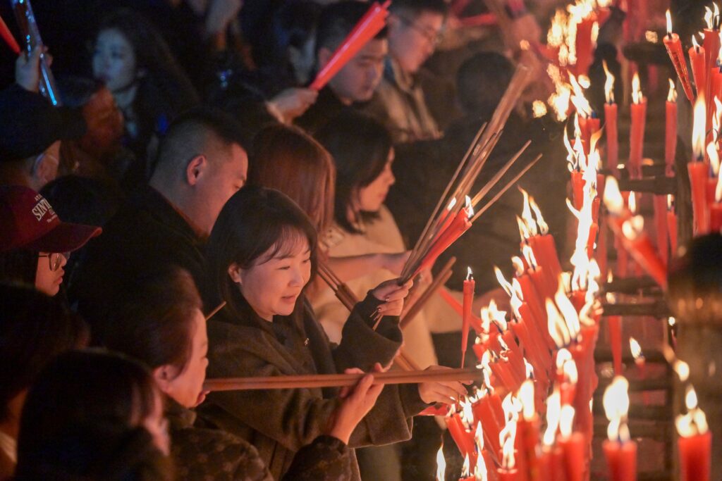 prayers inside Baoguo Temple on Mount Emei