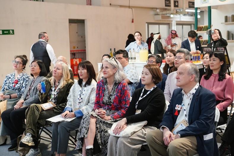 Guests view the Midnight Library 20th Anniversary commemorative video.