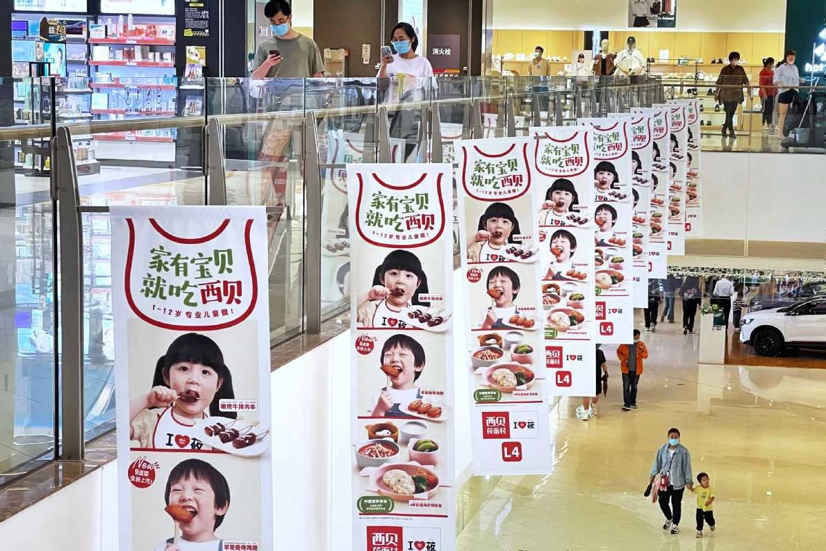 A view of the advertisements of Xibei Catering Group at a department store in Beijing. They are one of China's restuarants expanding overseas.